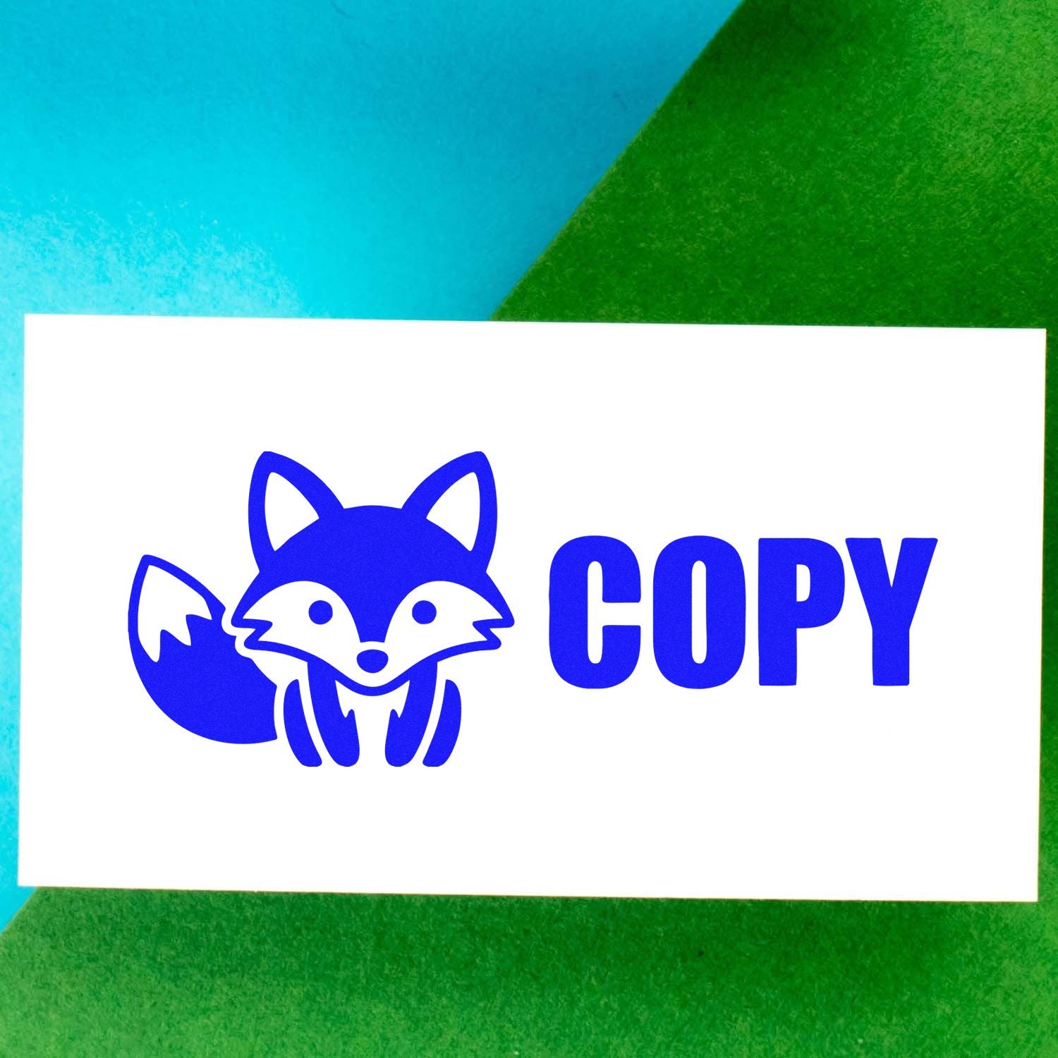 Blue fox COPY stamp and seal on white card, with blue and green background.