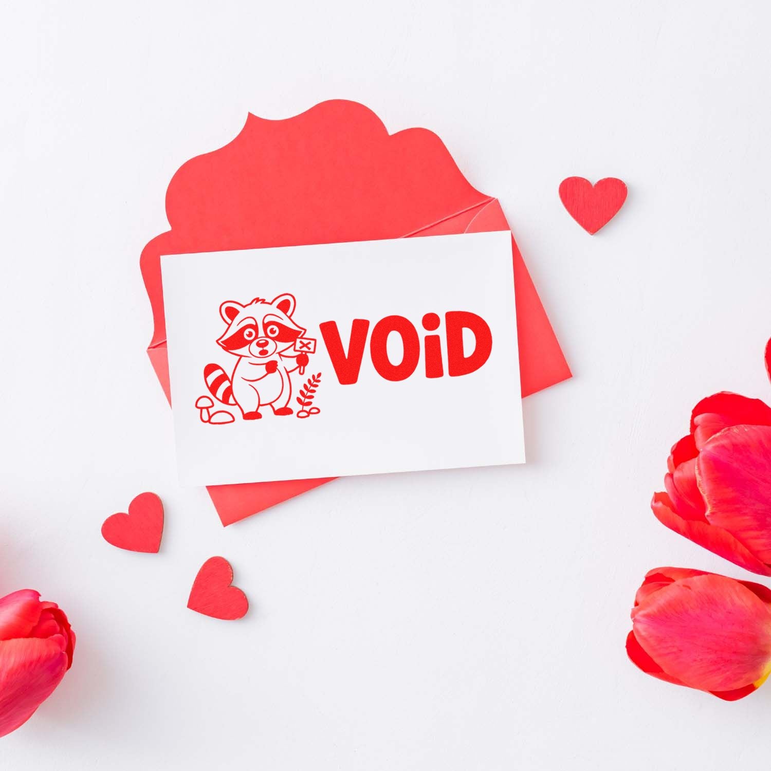 Red VOID stamp and seal card with raccoon design, pink-red envelope, hearts, and petals on white background.