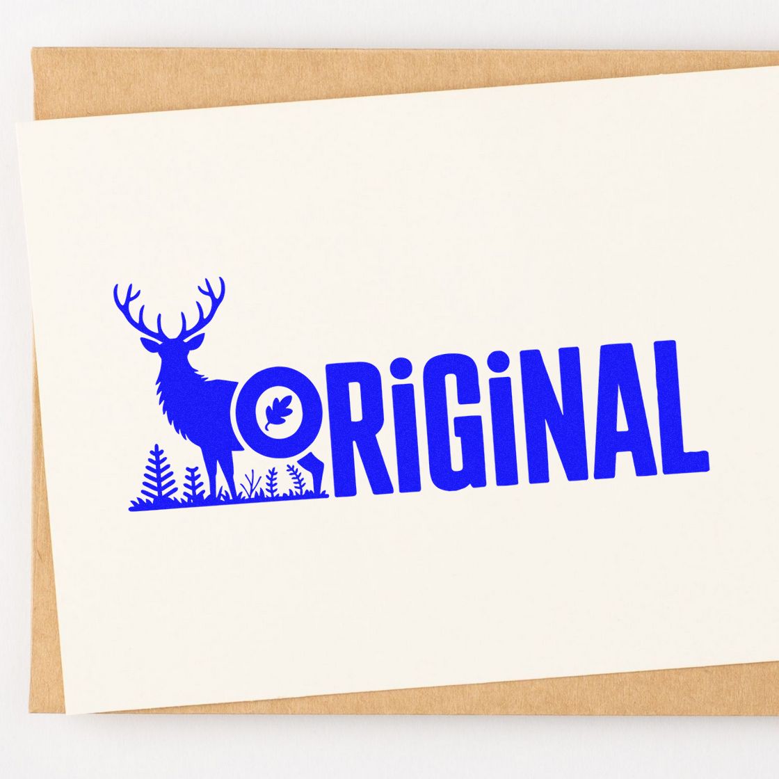 Blue ORIGINAL stamp with deer logo on white card over tan kraft envelope, for stamp and seal products.