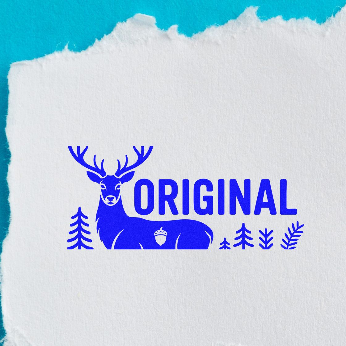 Blue ORIGINAL deer stamp seal on white textured paper, with trees and acorn, against turquoise background.
