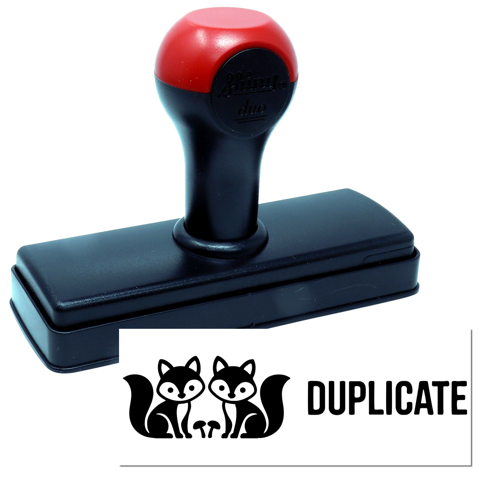 Black self-inking stamp with red handle and duplicate seal, showing a black fox logo and DUPLICATE text.