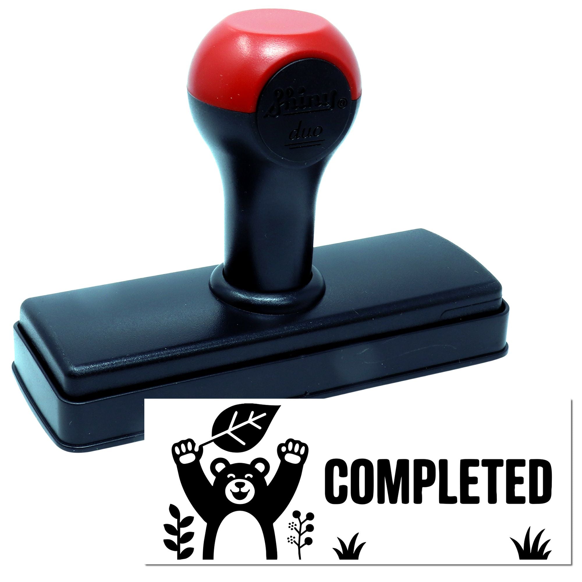 Red and black self-inking stamp with bear-and-leaf COMPLETED seal imprint