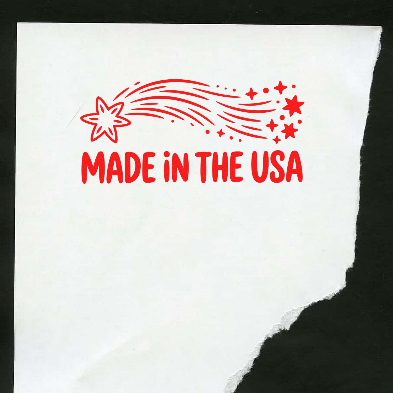 Red Made in the USA stamp seal with starburst and shooting stars on white paper.