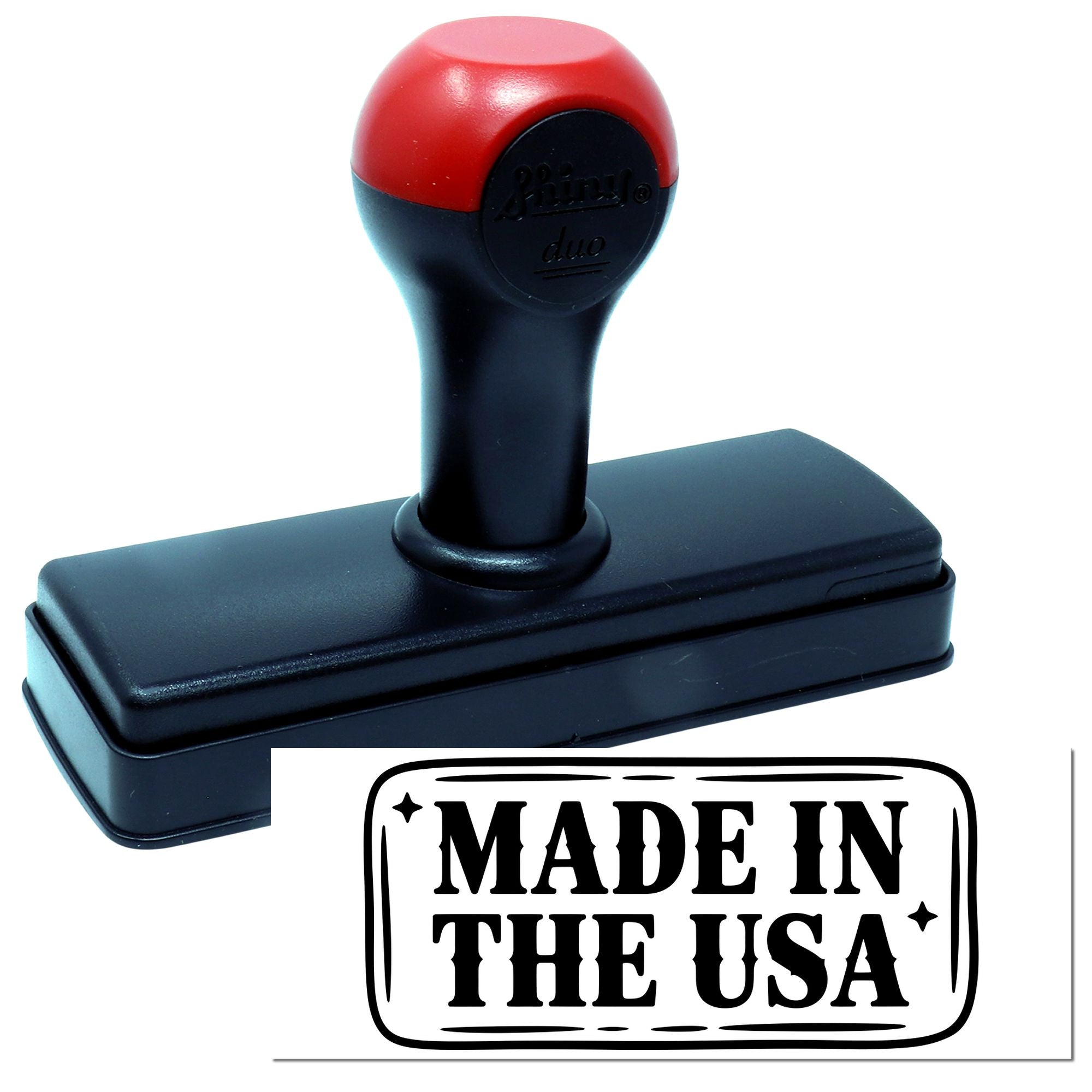 Black and red self-inking stamp with rectangular seal reading MADE IN THE USA in bold black text.