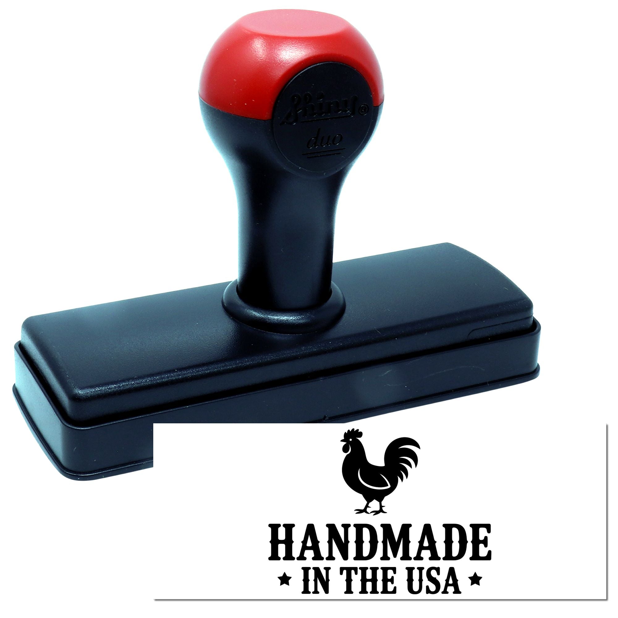Red and black self-inking stamp with rectangular black base, showing rooster seal and HANDMADE IN THE USA imprint.