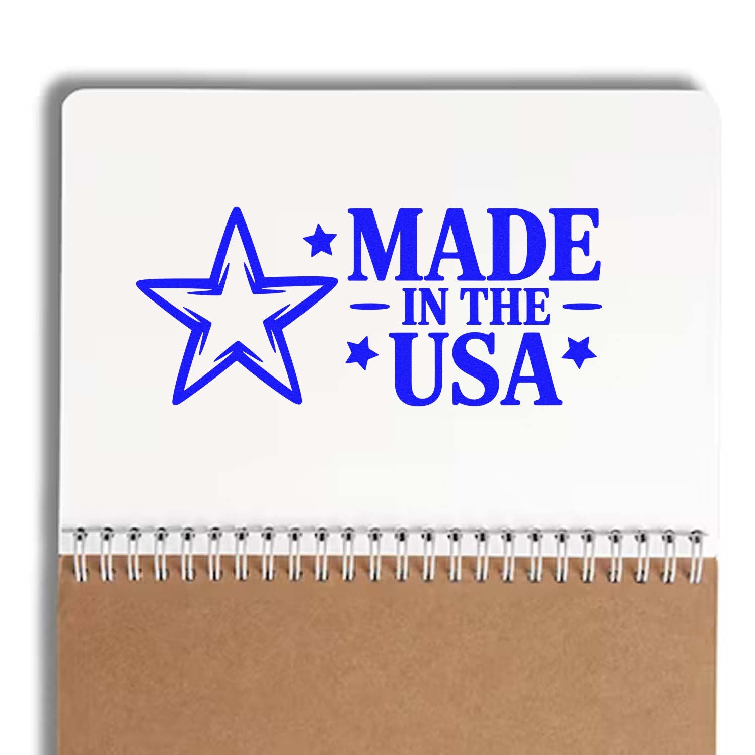 Blue Made in the USA stamp and seal with star on white notebook, spiral binding, kraft paper bottom