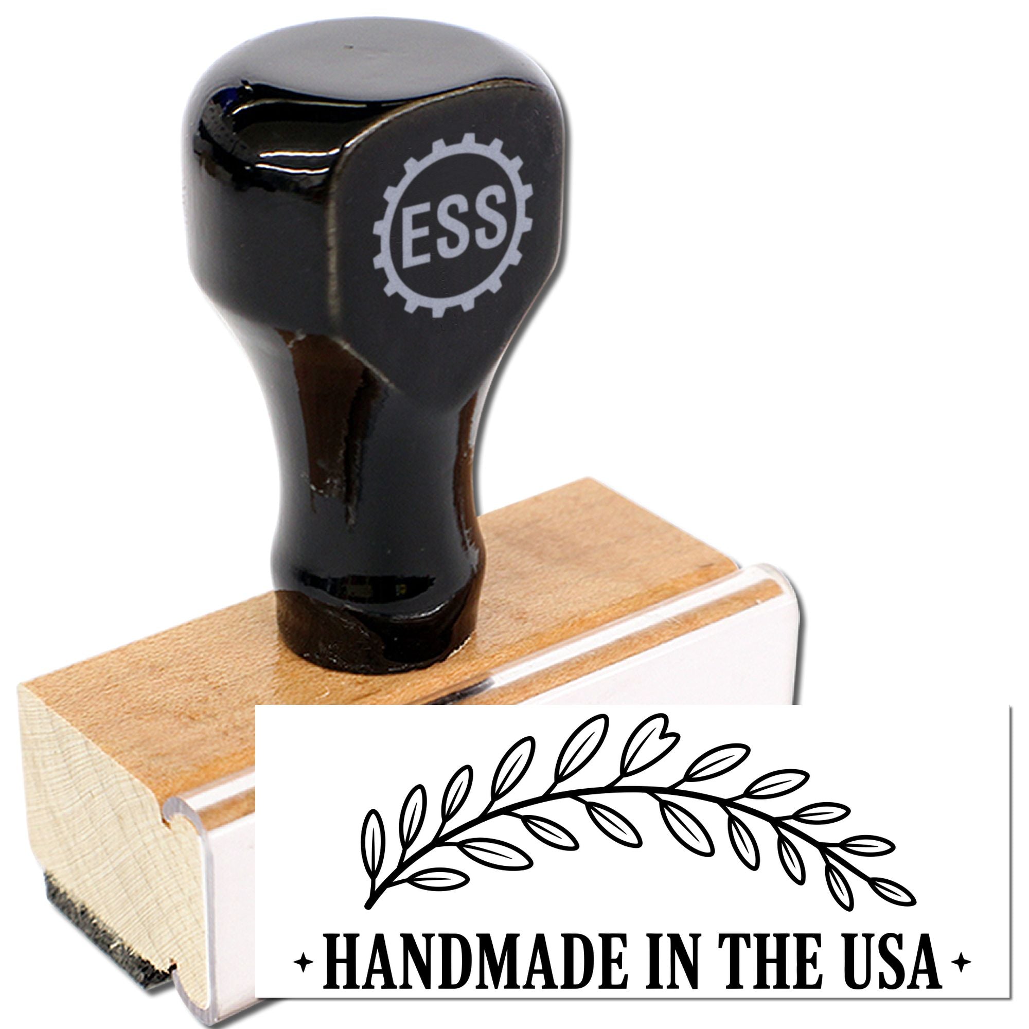 Black custom rubber stamp on wooden block with ESS logo, showing a Handmade in the USA seal with leaf design.
