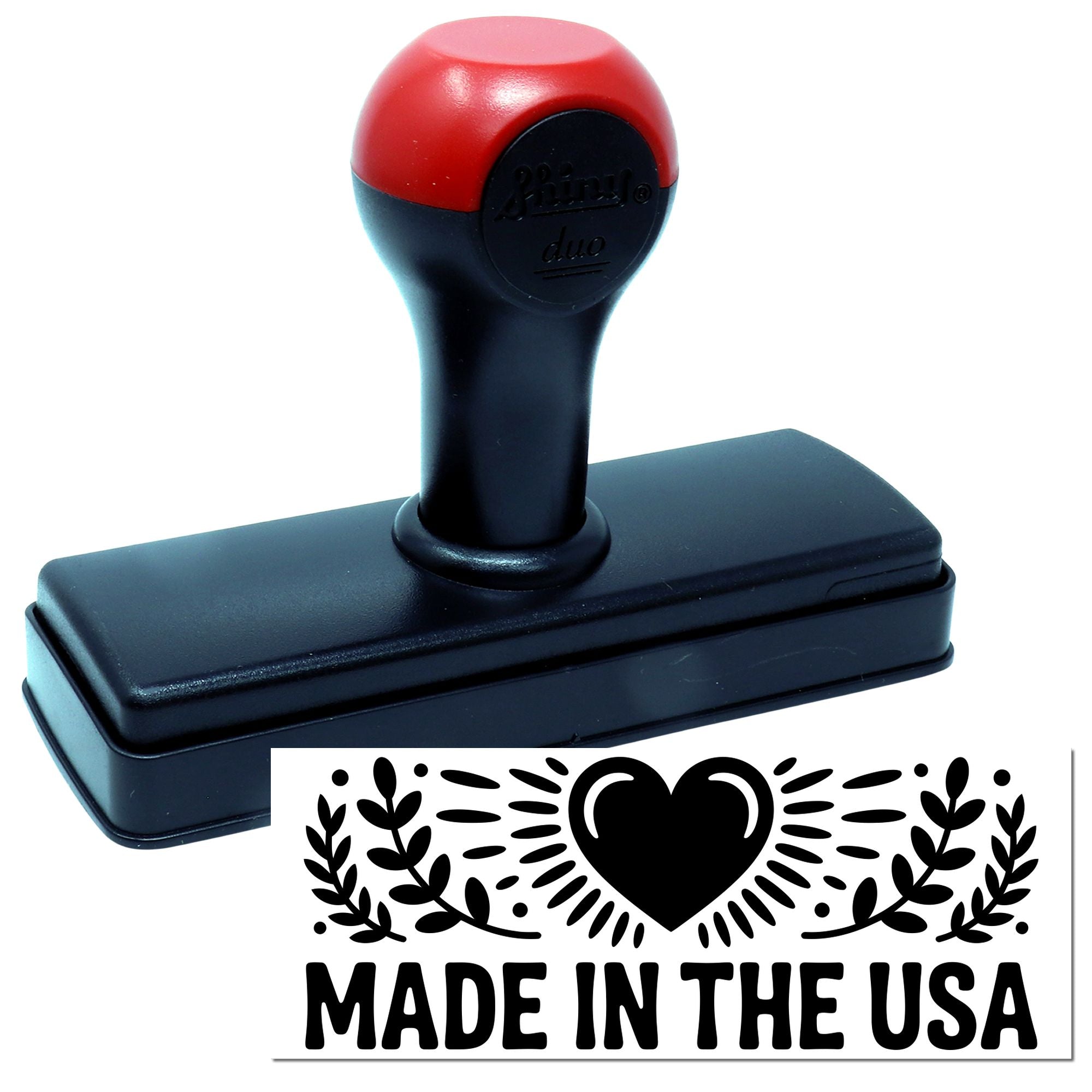 Red and black self-inking stamp with heart-and-leaf seal reading Made in the USA.