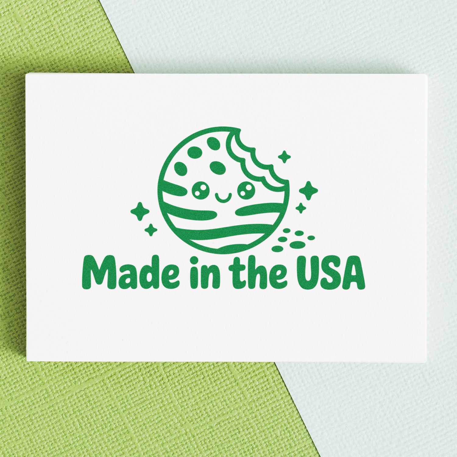 Green Made in the USA stamp with smiling seal icon and stars on a white card against a green and white textured background.