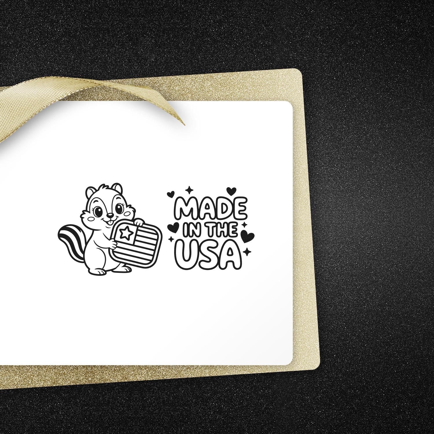 Black stamp seal with squirrel holding USA badge and Made in the USA on a white card with gold glitter backing.
