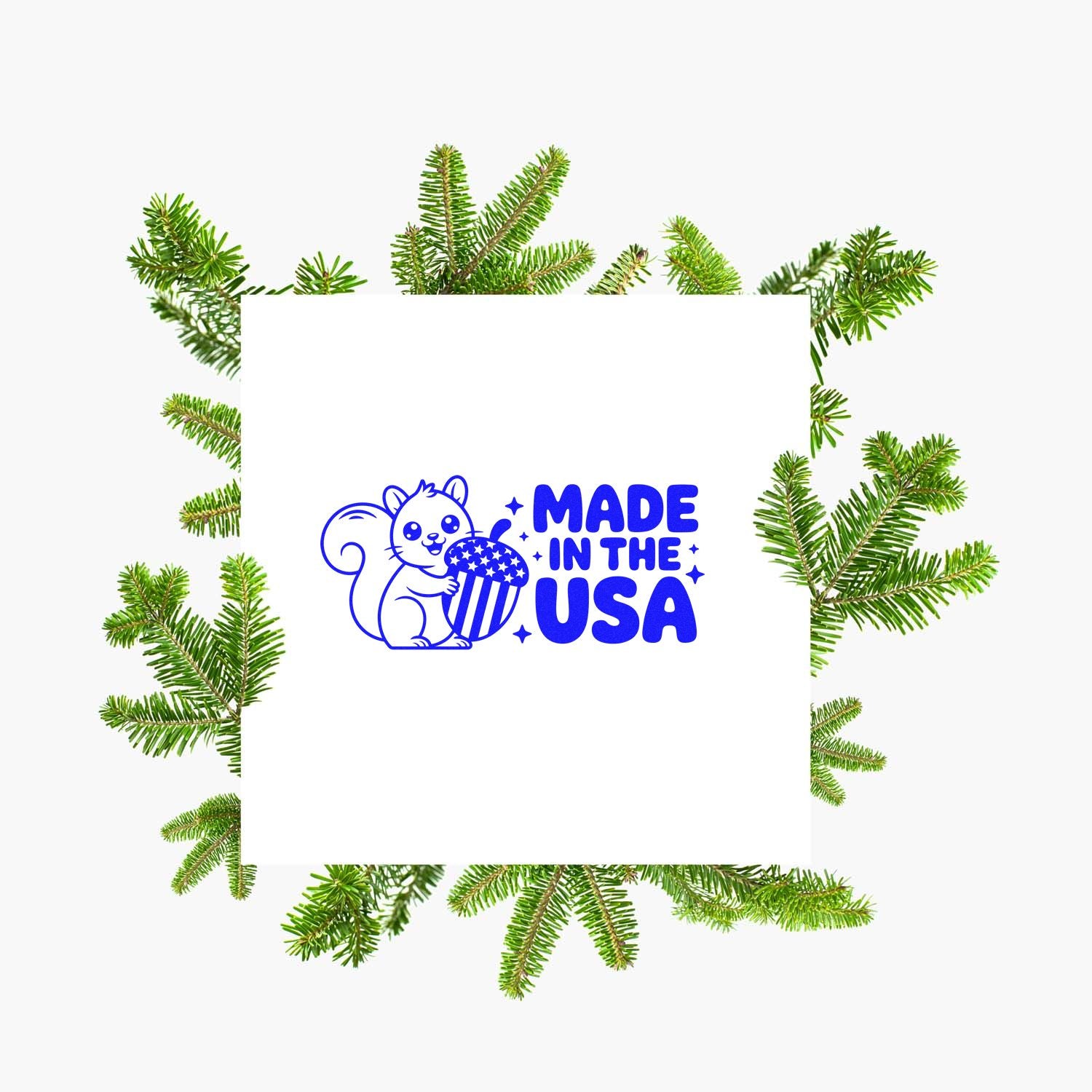 Blue Made in the USA rubber stamp seal with squirrel and popcorn, framed by green pine branches on white.