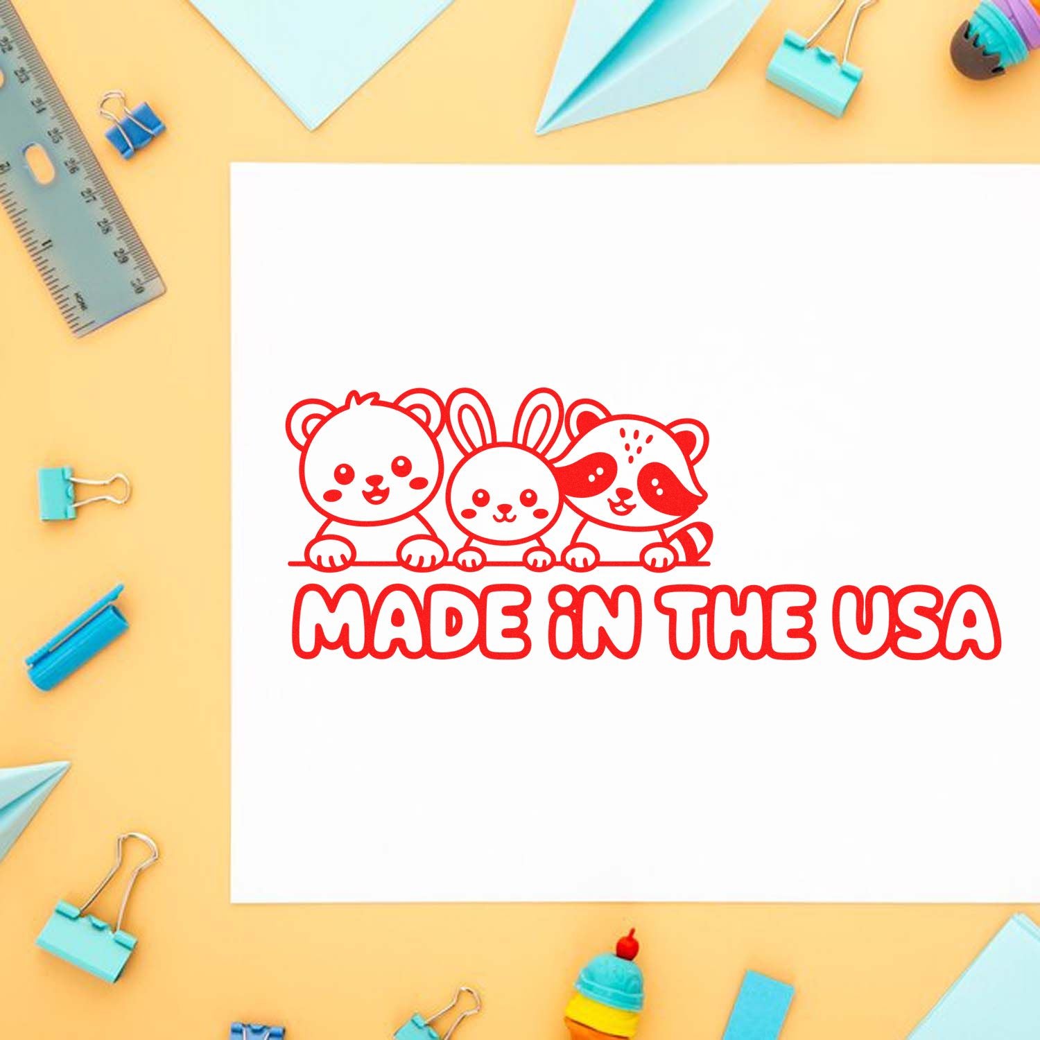 Red Made in the USA stamp seal with cute bear, bunny, and raccoon on white paper, surrounded by blue stationery.