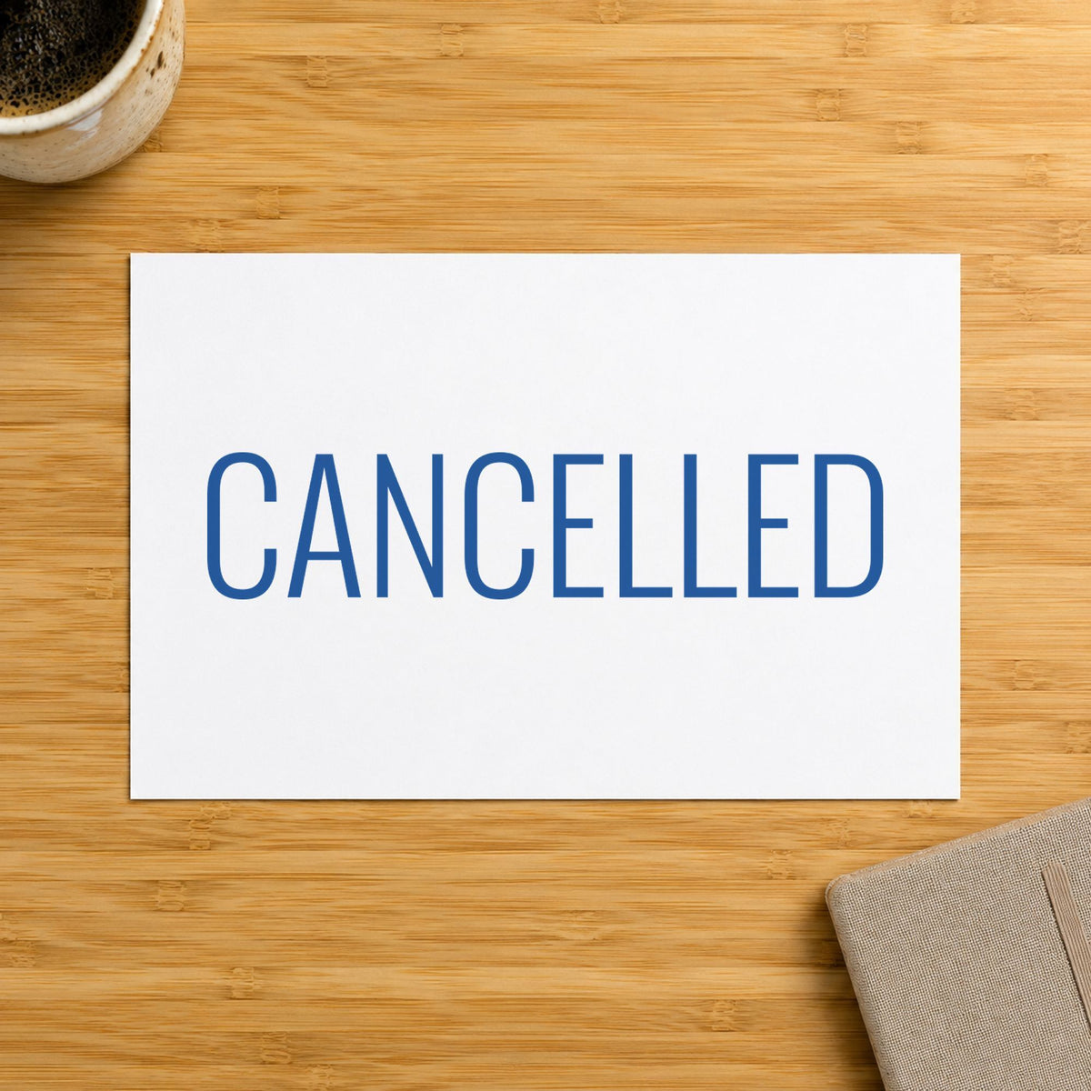 Pre-inked "Cancelled" stamp applied to a document, Approximately 1/2 in tall x 1-5/8 in wide impression