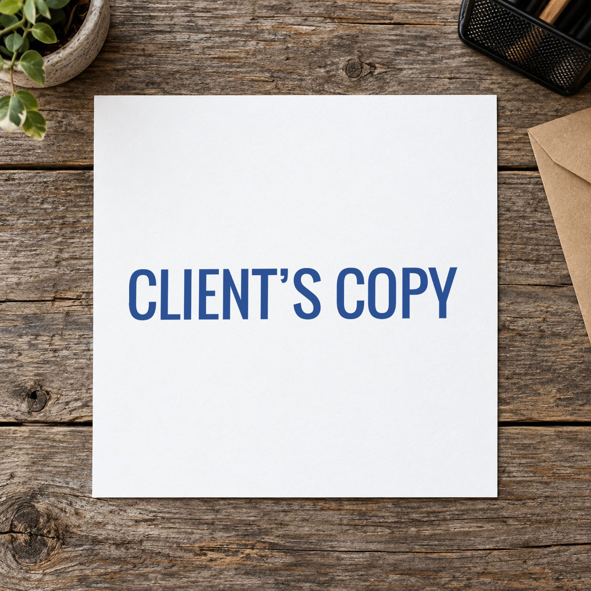 "Client's copy" Xstamper stamp in use on paper, 1/2 x 1-5/8 in rectangle imprint