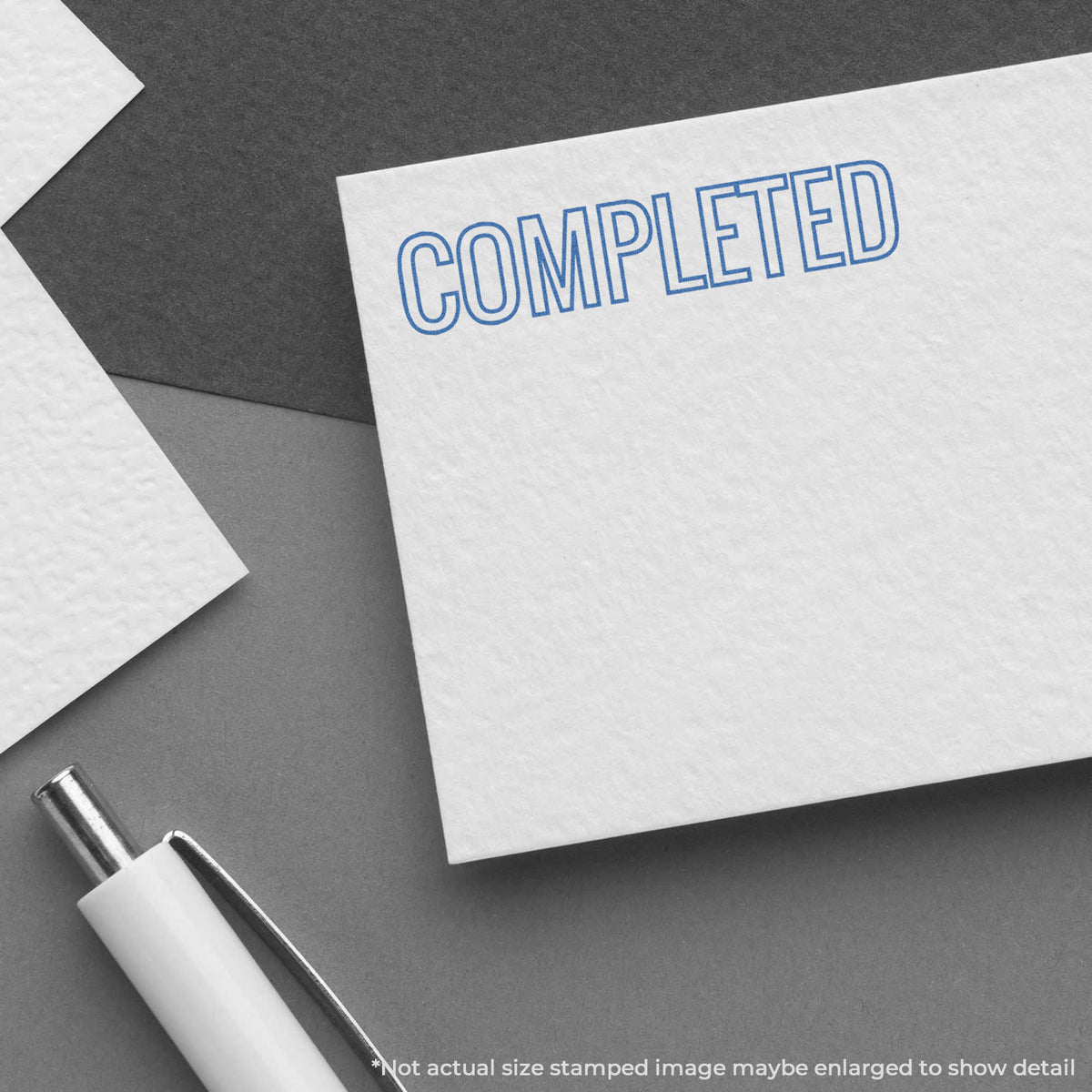 "Completed" pre-inked imprint on a page, rectangle shape at Approximately 1/2 in tall x 1-5/8 in wide