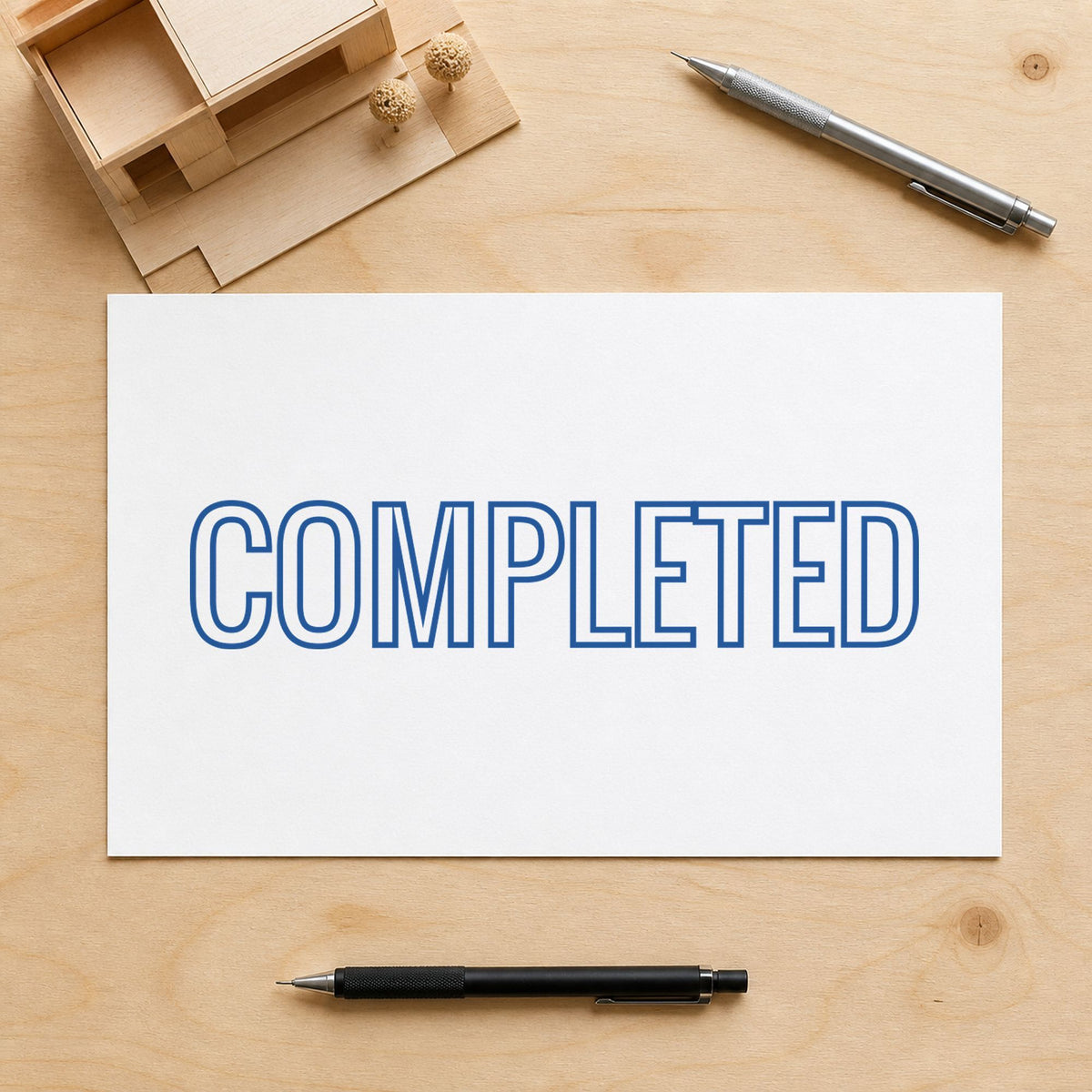 Pre-inked "Completed" stamp marking paperwork in an office setting