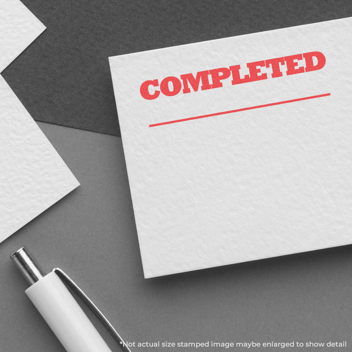 "Completed" pre-inked imprint on a page, rectangle shape at 1/2 x 1-5/8 in