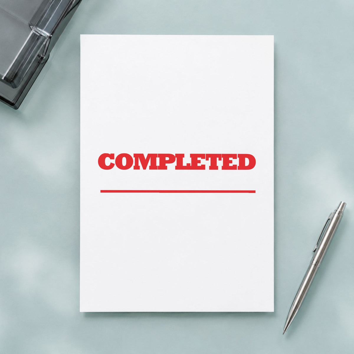 "Completed" stamp pressed on paper, no separate ink pad needed