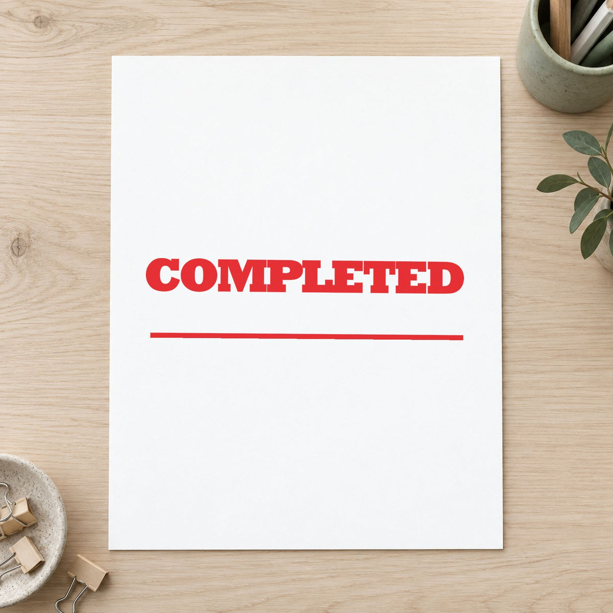 "Completed" Xstamper pre-inked stamp beside its rectangle imprint