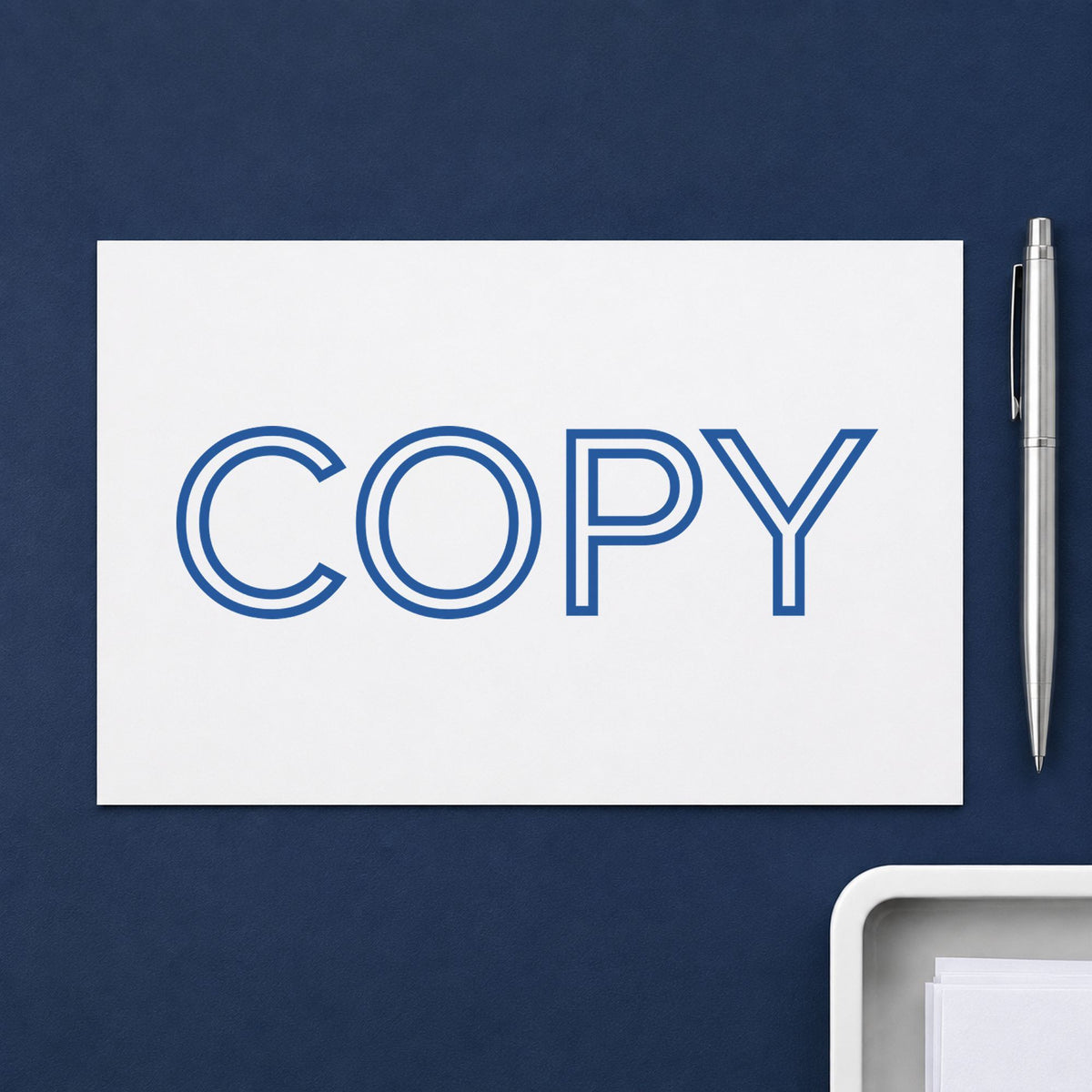 "Copy" Xstamper stamp in use on paper, Approximately 1/2 in tall x 1-5/8 in wide rectangle imprint