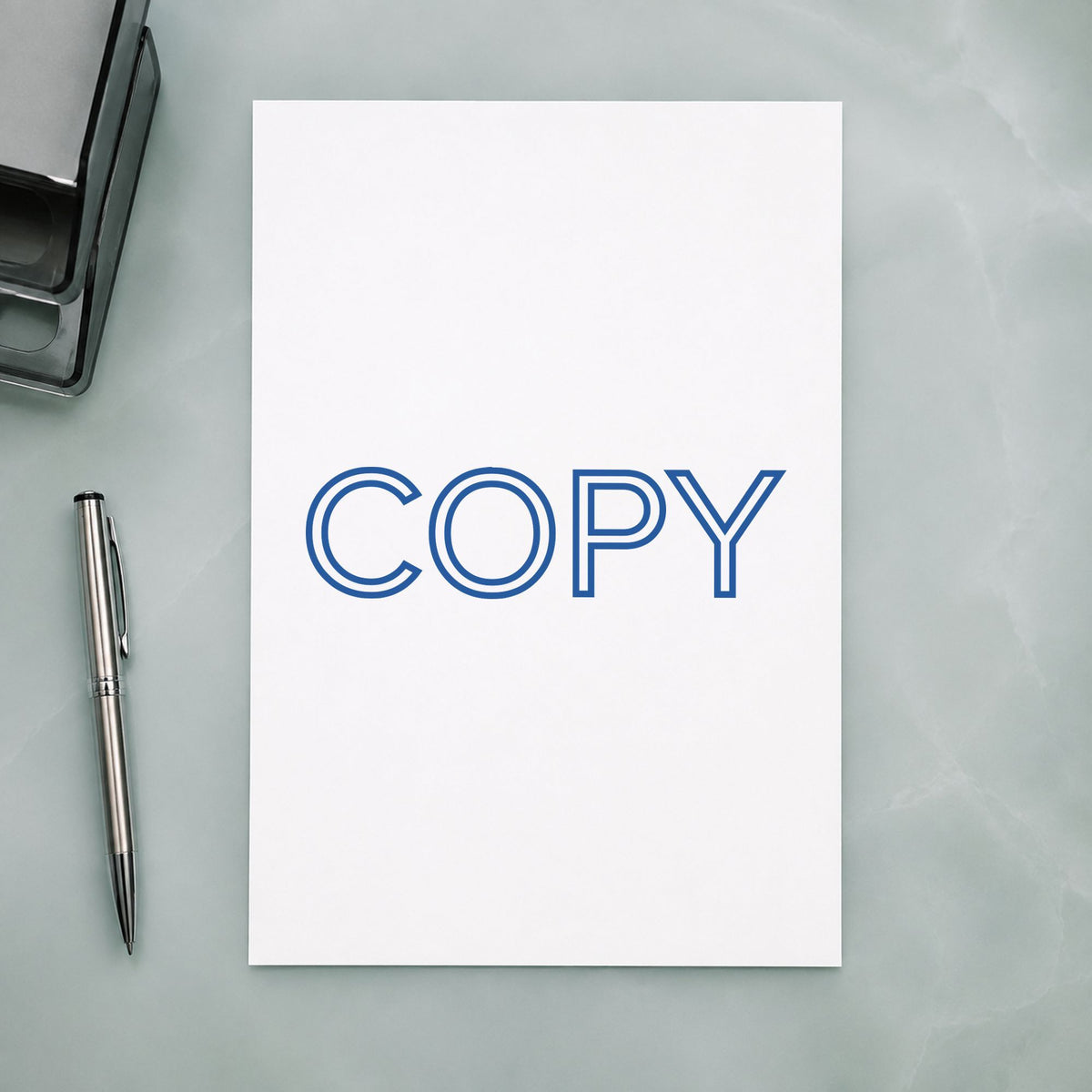 Pre-inked "Copy" stamp applied to a document, Approximately 1/2 in tall x 1-5/8 in wide impression
