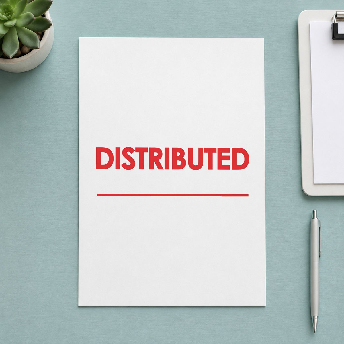 "Distributed" stamp pressed on paper, no separate ink pad needed
