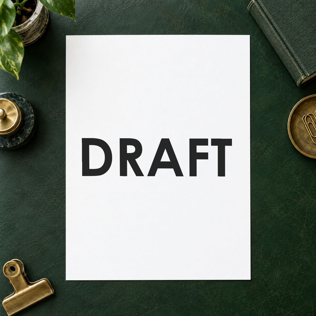 Pre-inked "Draft" stamp marking paperwork in an office setting