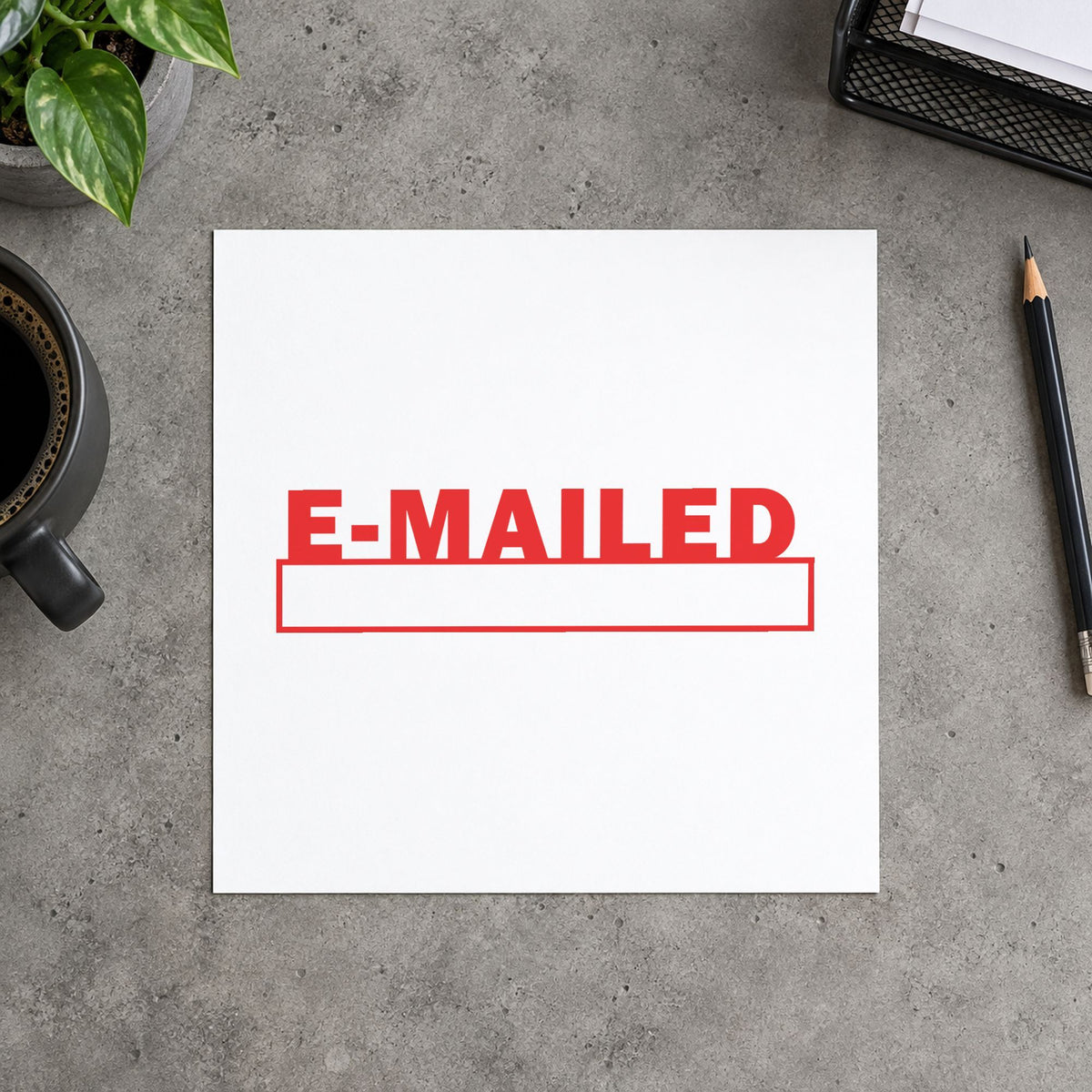 "E-mailed" Xstamper stamp in use on paper, Approximately 1/2 in tall x 1-5/8 in wide rectangle imprint