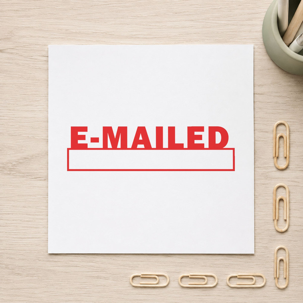 "E-mailed" stamp pressed on paper, no separate ink pad needed