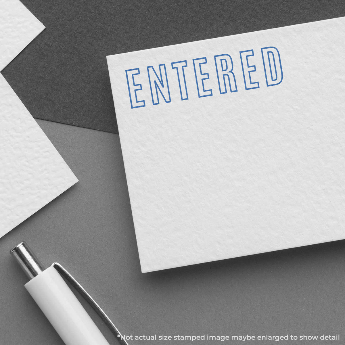 "Entered" pre-inked imprint on a page, rectangle shape at 1/2 x 1-5/8 in