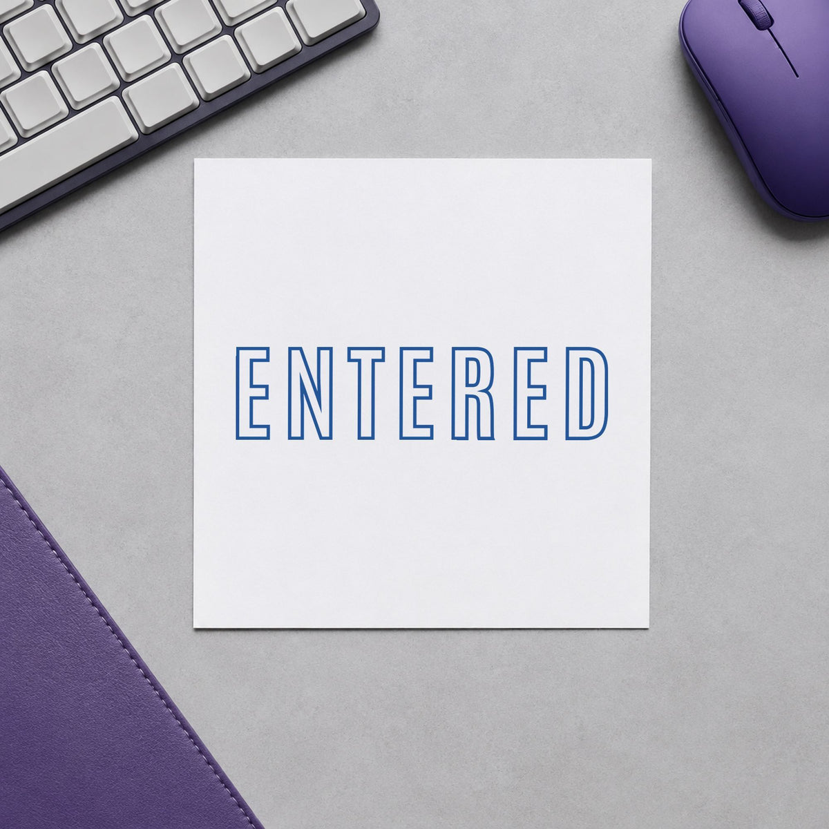"Entered" Xstamper stamp at work on everyday office paperwork
