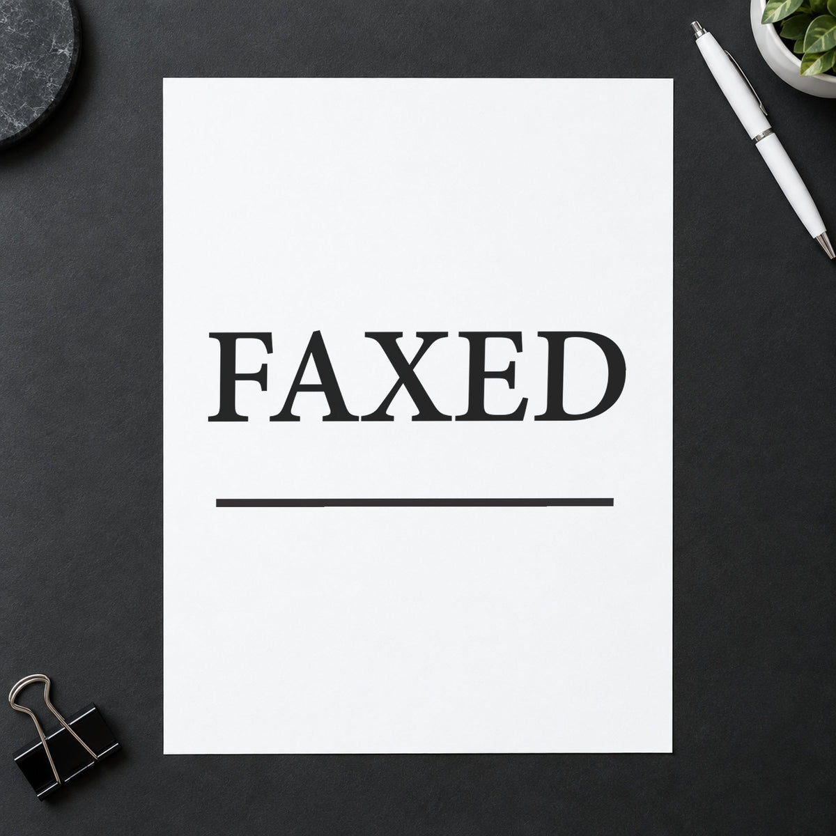 "Faxed" stamp pressed on paper, no separate ink pad needed
