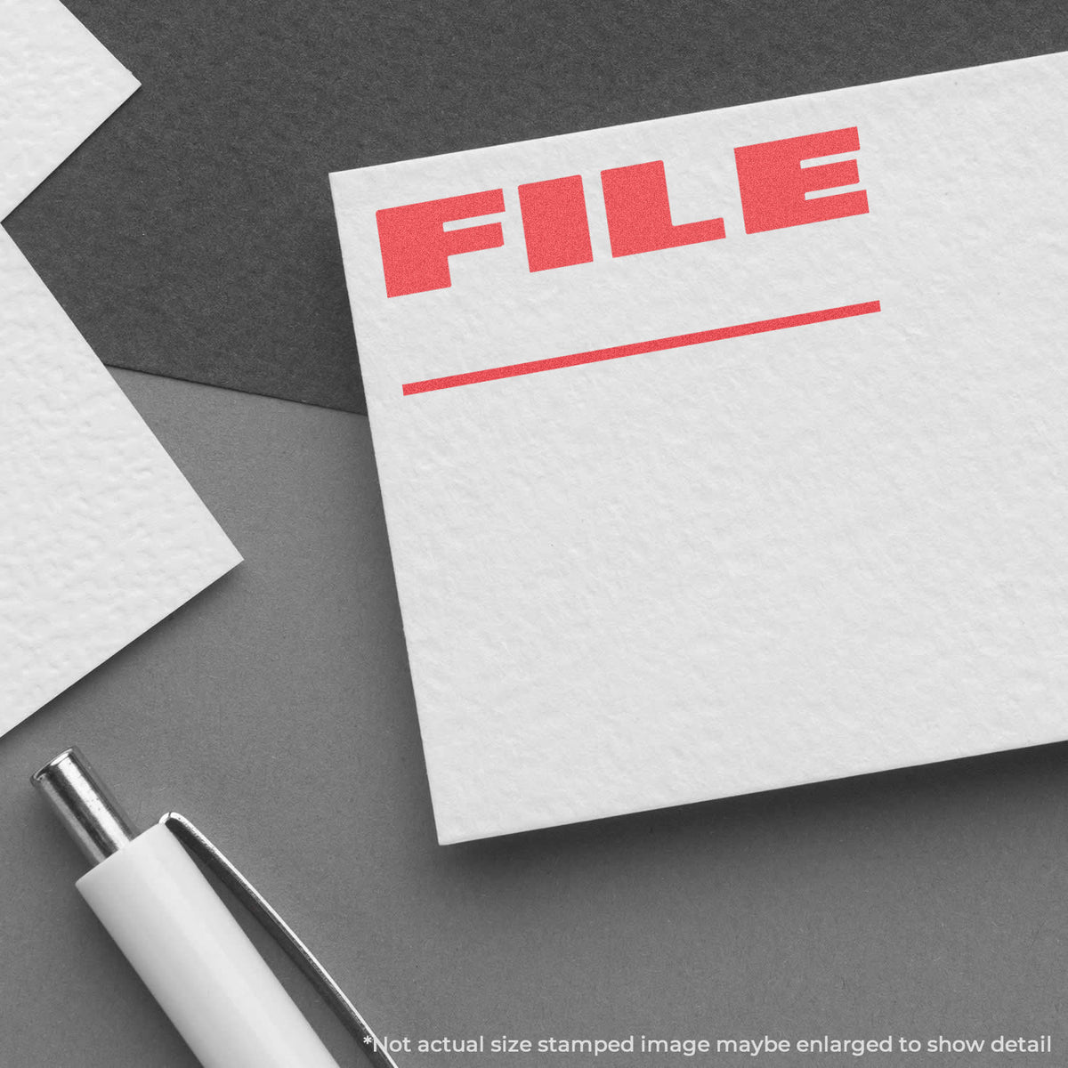 "File" pre-inked imprint on a page, rectangle shape at Approximately 1/2 in tall x 1-5/8 in wide