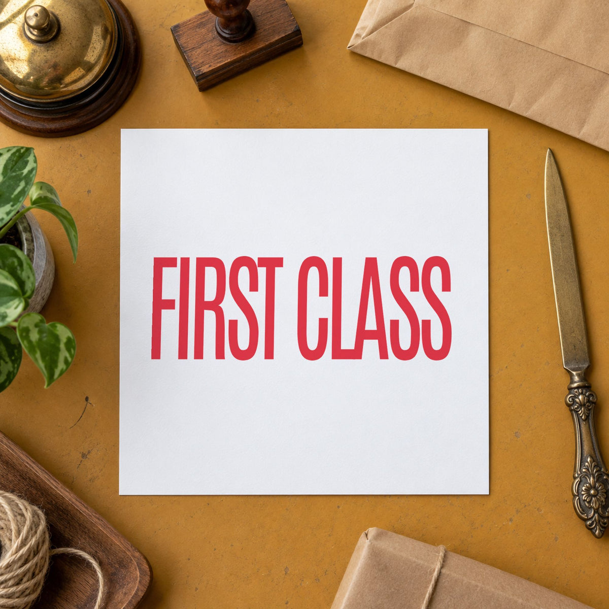 Pre-inked "First class" stamp marking paperwork in an office setting