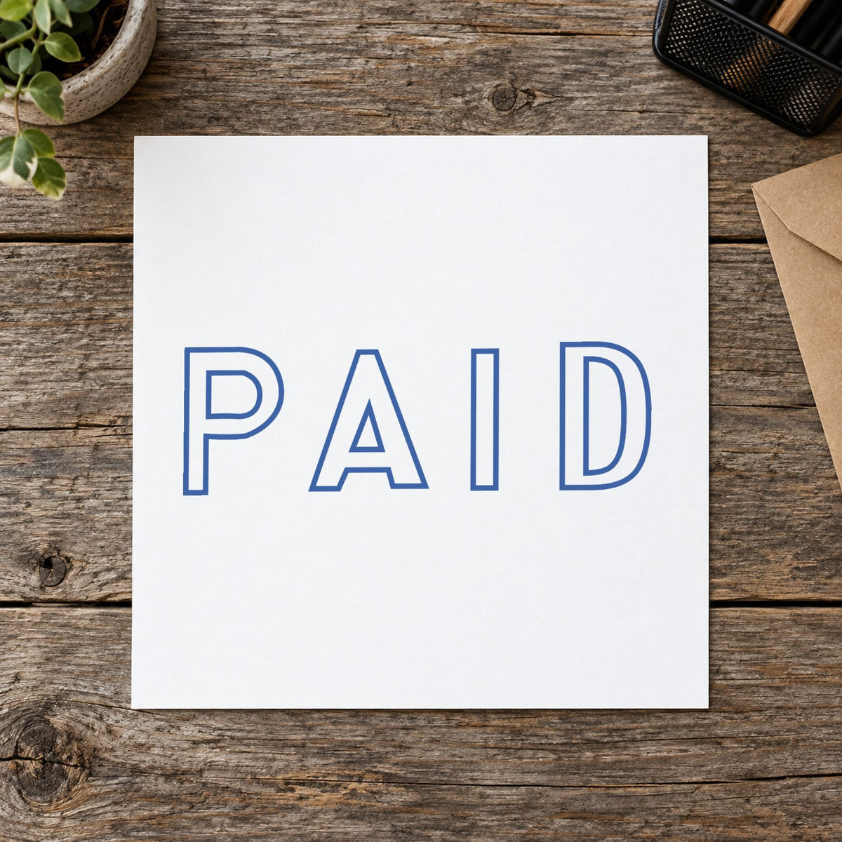 "Paid" stamp pressed on paper, no separate ink pad needed