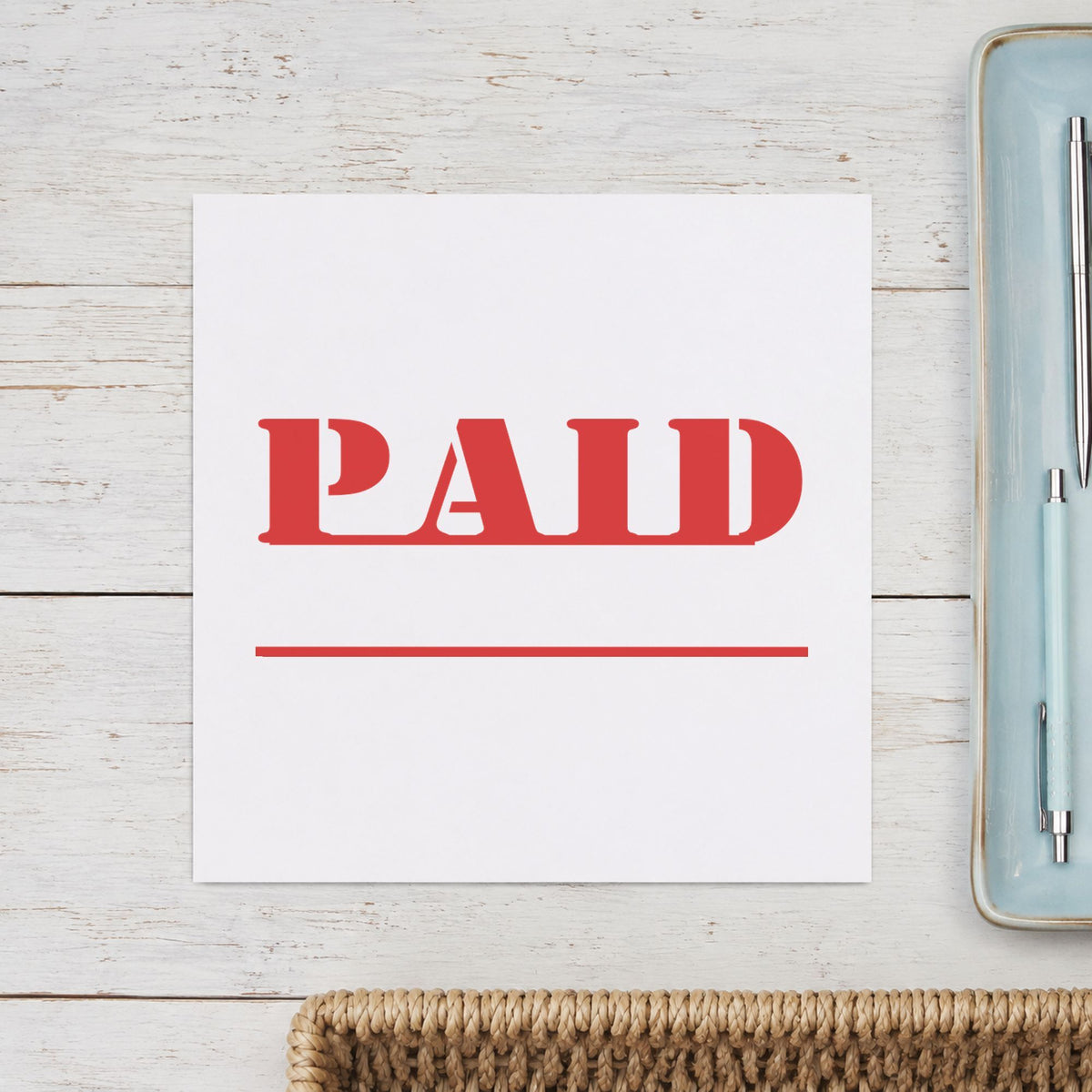 "Paid" Xstamper stamp at work on everyday office paperwork