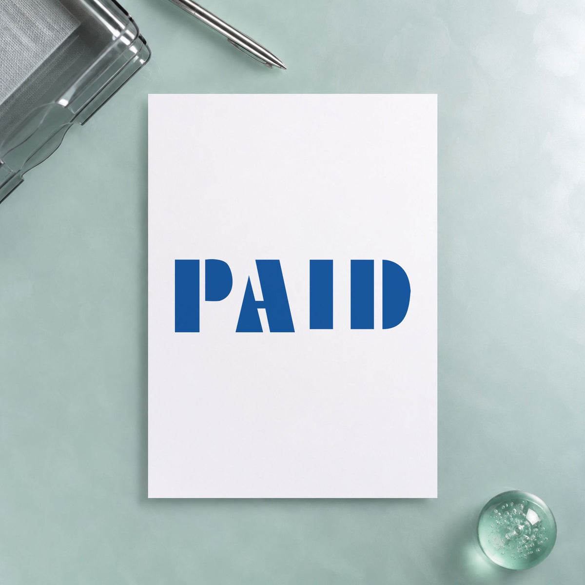 "Paid" imprint on a printed page, Xstamper No. 1335
