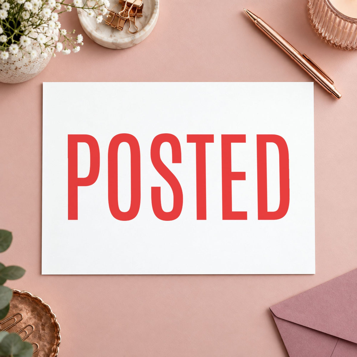 Pre-inked "Posted" stamp marking paperwork in an office setting