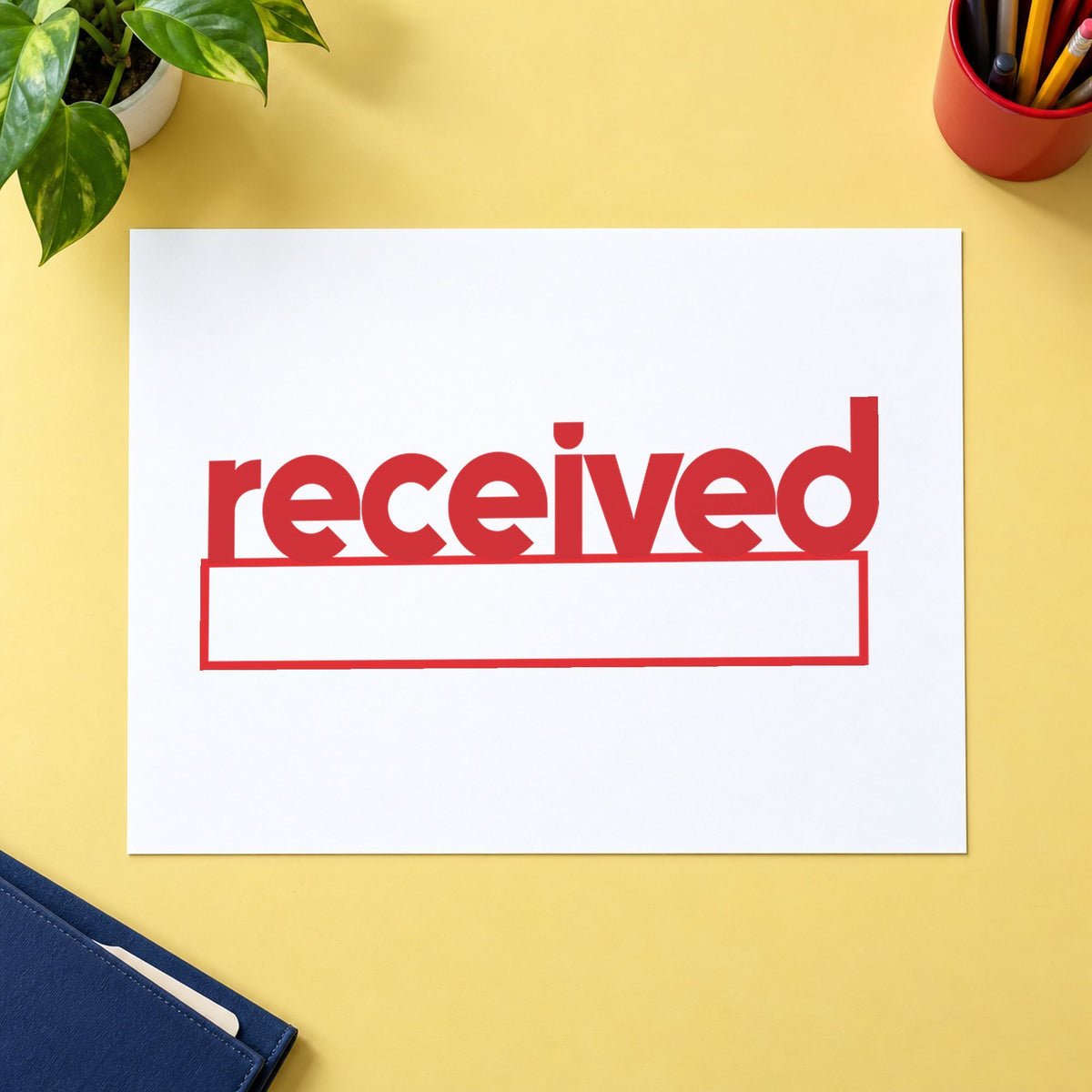 Pre-inked "Received" stamp marking paperwork in an office setting