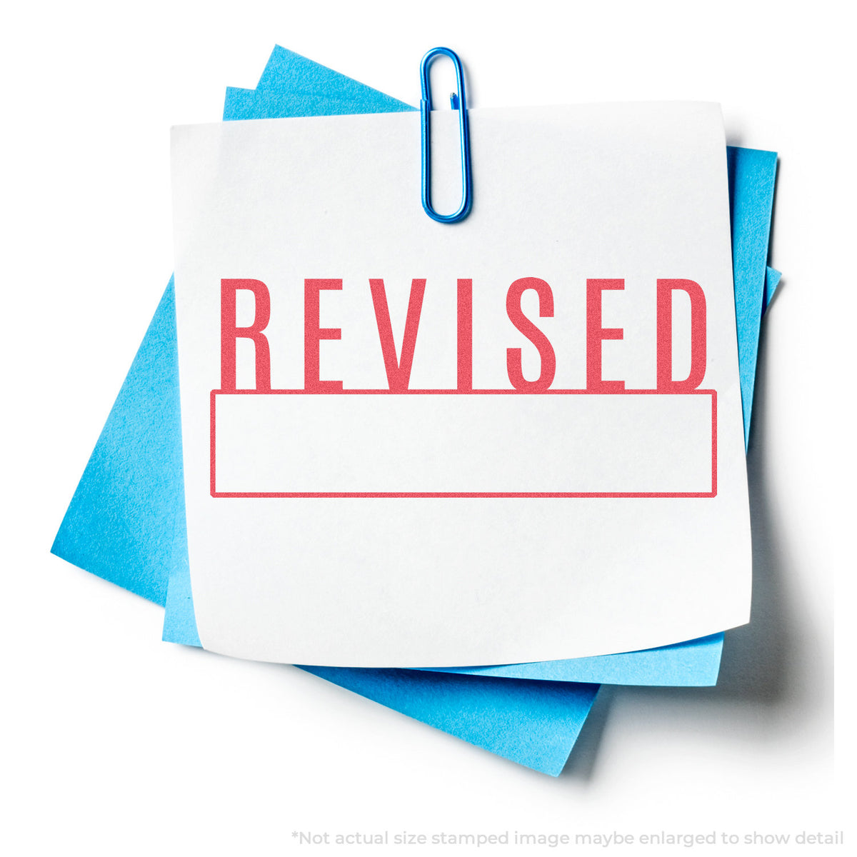 "Revised" stamp and its crisp 1/2 x 1-5/8 in impression on paper
