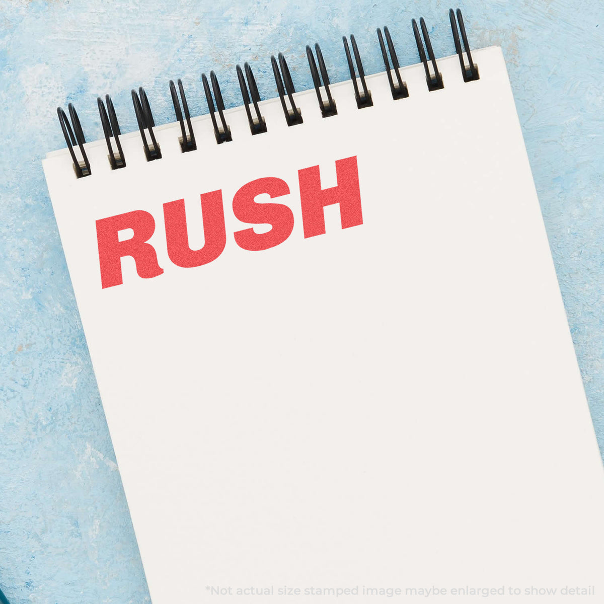 "Rush" pre-inked imprint on a page, rectangle shape at Approximately 1/2 in tall x 1-5/8 in wide