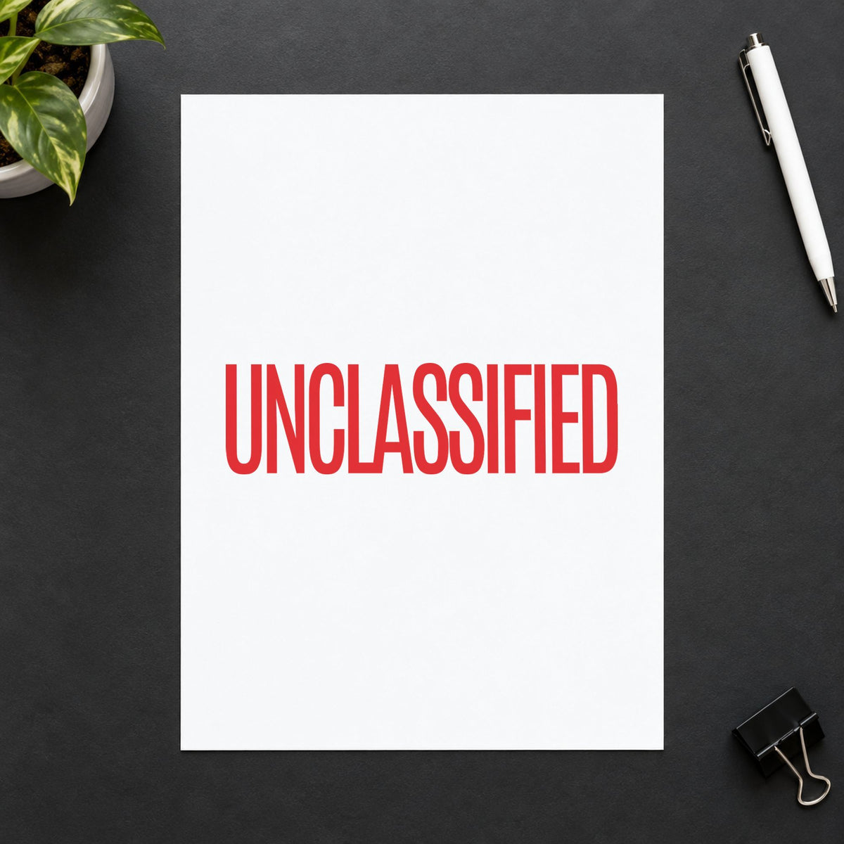 "Unclassified" Xstamper pre-inked stamp beside its rectangle imprint