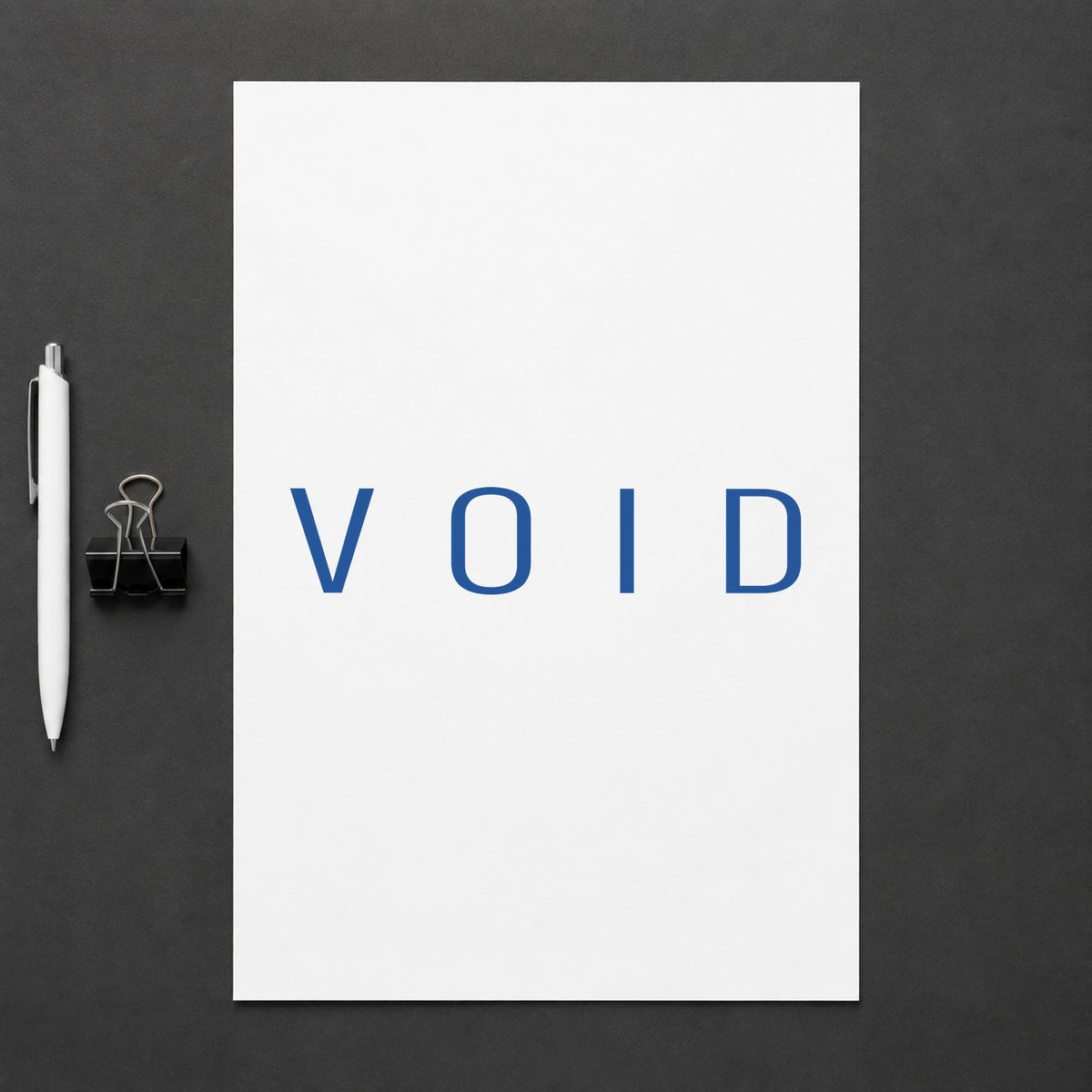 Pre-inked "Void" stamp marking paperwork in an office setting