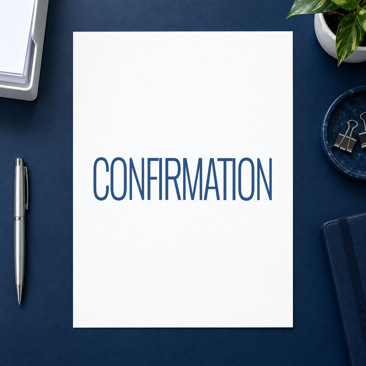 "Confirmation" Xstamper stamp in use on paper, 1/2 x 1-5/8 in rectangle imprint