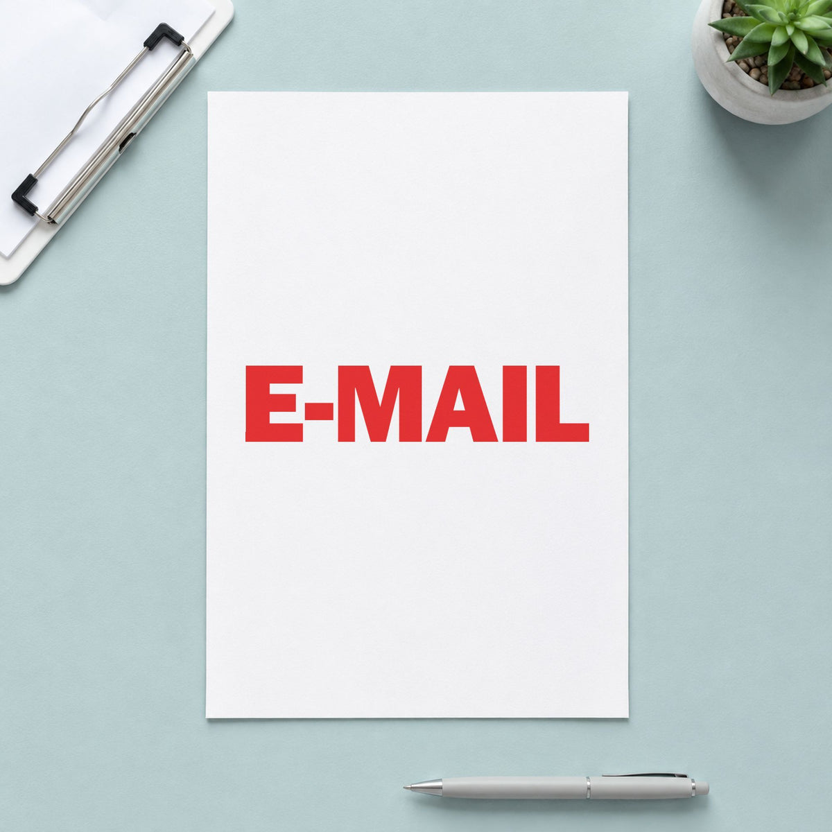 "E-mail" Xstamper pre-inked stamp beside its rectangle imprint