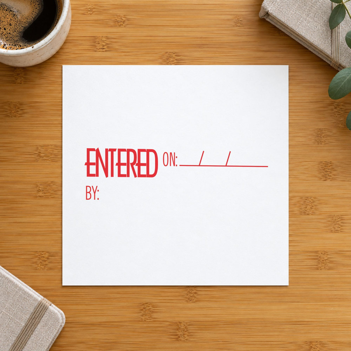 "Entered on: by:" stamp pressed on paper, no separate ink pad needed