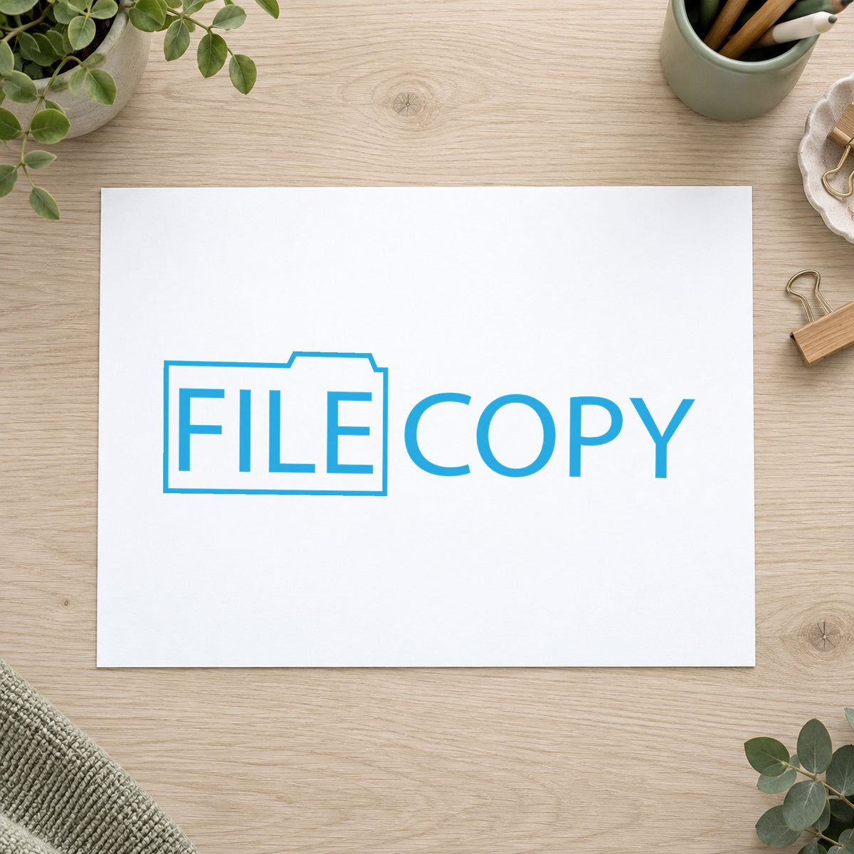 Pre-inked "File copy" stamp marking paperwork in an office setting