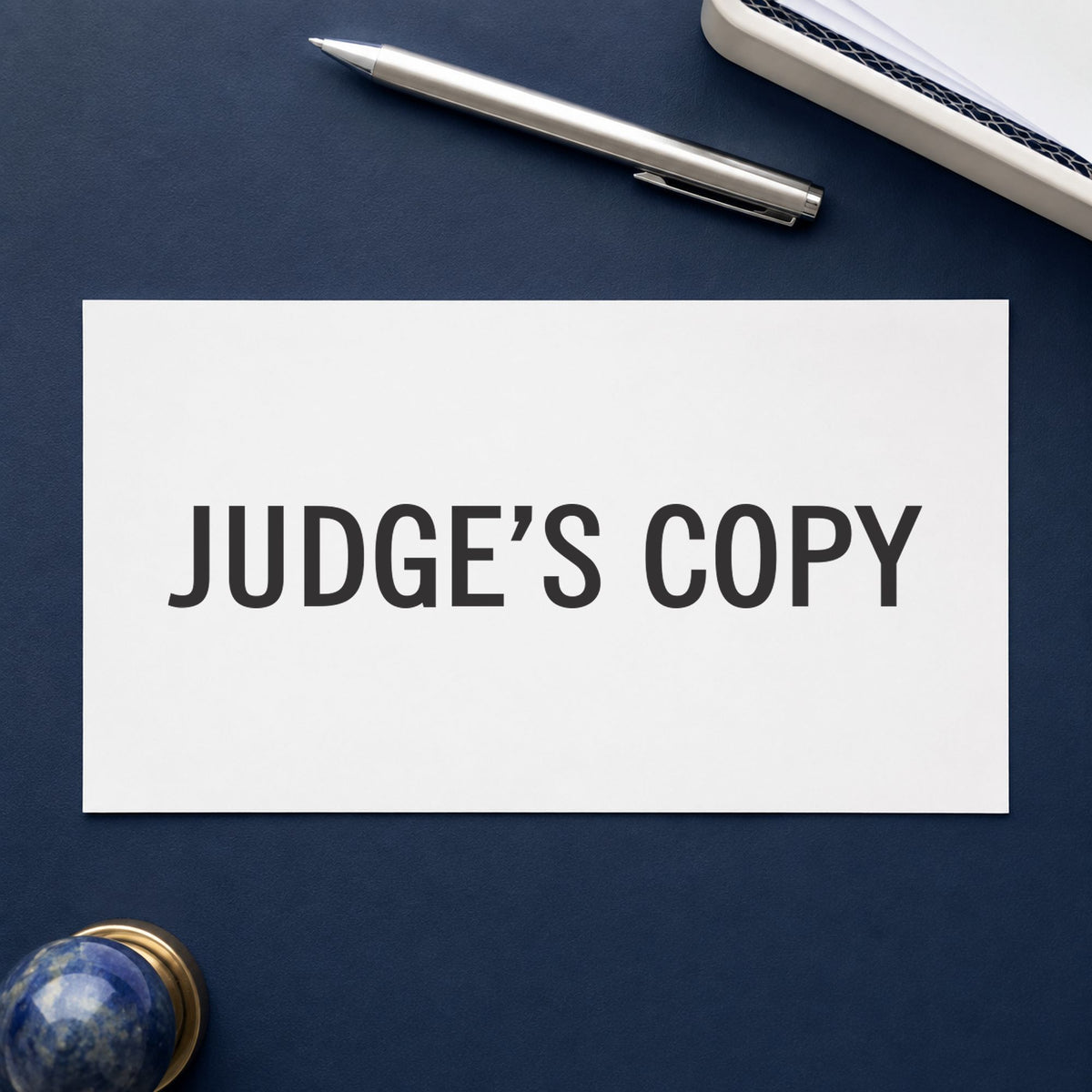 "Judge's copy" stamp pressed on paper, no separate ink pad needed