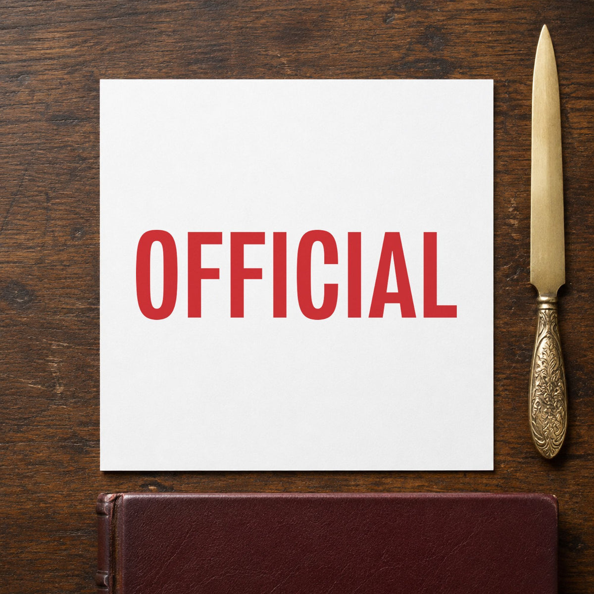 "Official" Xstamper stamp in use on paper, Approximately 1/2 in tall x 1-5/8 in wide rectangle imprint