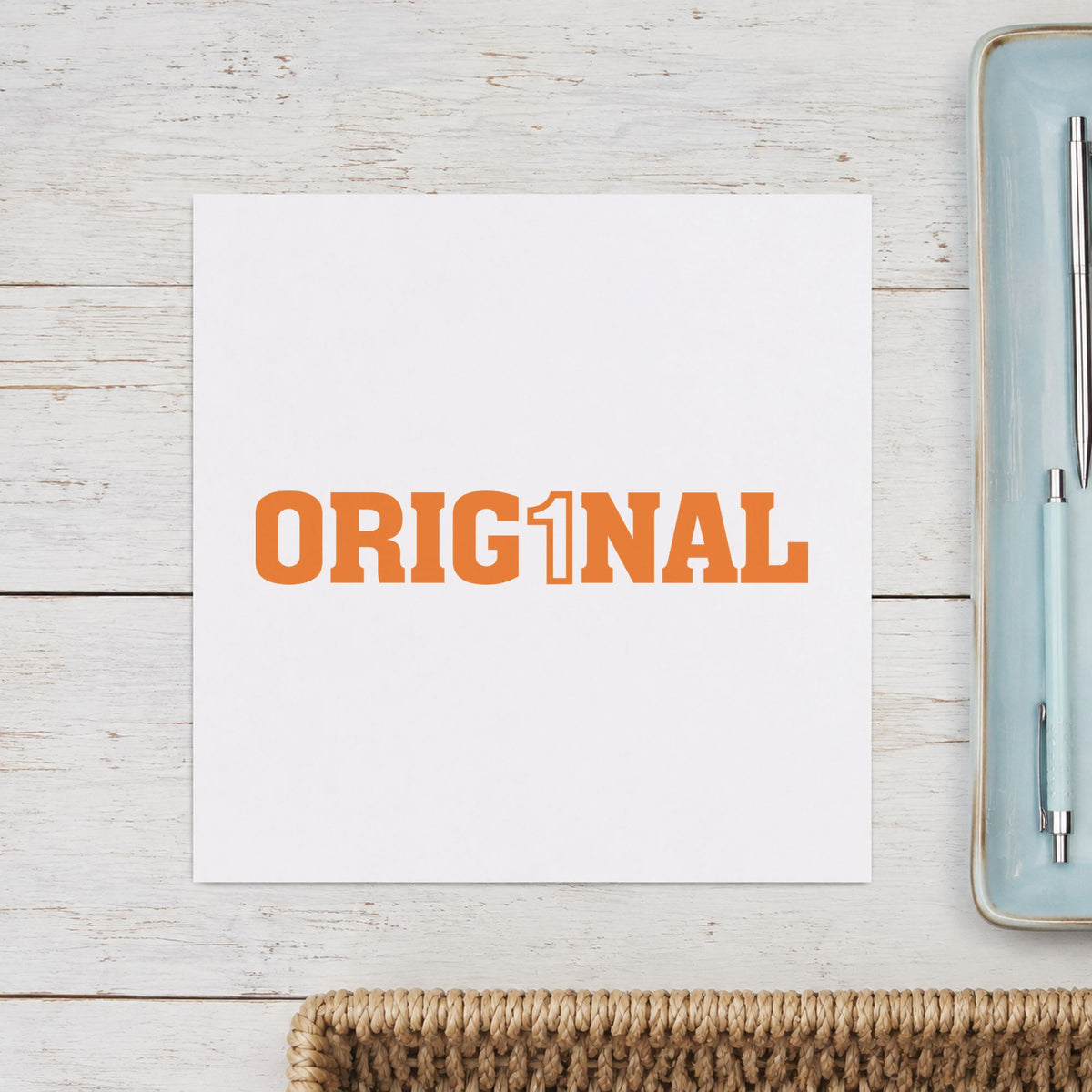 "Orig1Nal" Xstamper stamp in use on paper, Approximately 1/2 in tall x 1-5/8 in wide rectangle imprint